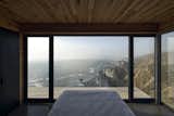 The bedrooms, located on the upper level, also look to views of the ocean.