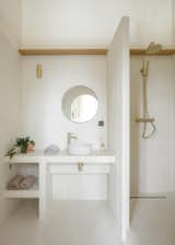 Lekien designed a built-in concrete vanity for the bathroom, creating a minimalist aesthetic for the space.