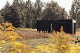 Exterior, Cabin Building Type, Metal Siding Material, Wood Siding Material, and Flat RoofLine Nokken modular cabin can be customized to suit almost any natural setting.  Photo 10 of 11 in A Svelte $79K Prefab Cabin Promises to Work as Well in Your Backyard as It Does in the Woods