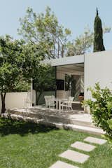 Exterior, ADU Building Type, and Flat RoofLine The company customized a floor plan for the ADU that would accommodate and incorporate existing fruit trees in the yard.  Photo 2 of 11 in In Los Angeles, a 900-Square-Foot Prefab ADU Brings One Family Closer Together