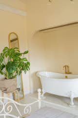 The clawfoot tub in the primary bathroom is from Kohler; the plant is from Juanita's Plants.  Photo 10 of 14 in Meet the Women Who Reimagined a Hudson Valley Farmhouse as a BIPOC Residency