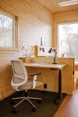 A work station by Branch Furniture includes a sit/stand desk and a task chair.