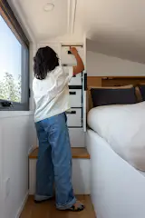 A closet with drawers provides added storage in the second bedroom.