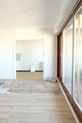 The existing kitchen was delineated from the dining and living areas by a square wall opening.