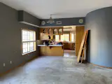 The previous kitchen was cramped and featured drab wood cabinetry.