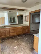The primary bathroom was large but needed much work.