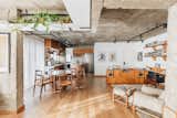 <span style="font-family: Theinhardt, -apple-system, BlinkMacSystemFont, &quot;Segoe UI&quot;, Roboto, Oxygen-Sans, Ubuntu, Cantarell, &quot;Helvetica Neue&quot;, sans-serif;">The  apartment in the heart of São Paulo, Brazil, that FJ55 Arquitetos renovated for Carolina Quevedo and Marcus Watari was once a podcast studio. The space's wide open living area, kitchen, and dining space are outfitted with Tauari wood floors and feature raw concrete ceilings, beams, and pillars.</span>