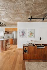 <span style="font-family: Theinhardt, -apple-system, BlinkMacSystemFont, &quot;Segoe UI&quot;, Roboto, Oxygen-Sans, Ubuntu, Cantarell, &quot;Helvetica Neue&quot;, sans-serif;">Custom cabinetry made from Freijó wood holds a pair of speakers, a turntable, and an extensive vinyl record collection.</span>