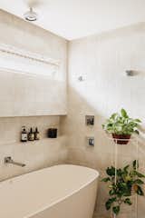 The ceramic wall tile in one of the bathrooms if from Portobello America, and the tub is by Sabbia.