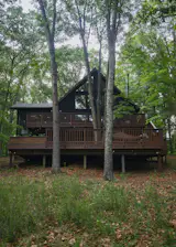 Julie and Malcom repaired and refinished the cabin's expansive pine decks, which offer places to sit and watch the seasons change.