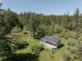Solar photovoltaic panels on the cabin's shed-style roof produce hot water and electricity for the cabin, named Sol Shed in honor of its main energy source.