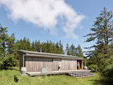 <span style="font-family: Theinhardt, -apple-system, BlinkMacSystemFont, "Segoe UI", Roboto, Oxygen-Sans, Ubuntu, Cantarell, "Helvetica Neue", sans-serif;">Rolling screen doors along the south elevation protect the cabin from storms, UV exposure, and wildlife. </span>