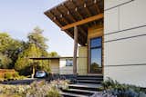 Live-edge oak  harvested on site was used as both structure and guardrail at the central stair to the bedroom wing.  Photo 8 of 9 in High-Performance Courtyard House by Arkin Tilt Architects