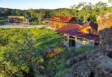 A small guesthouse including a sauna and all mechanical systems is located parallel to the pool, screening the solar collectors from views from the main house and terraces.
