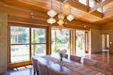 Large barn doors and the courtyard increase the livable space of this modest home.