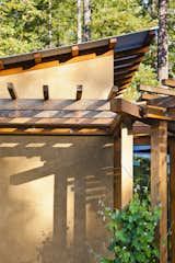 Trellises planted with deciduous vines provide shading for the interior spaces during the warmer times of year, eliminating the need for cooling.
