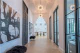 Hallway and Light Hardwood Floor  Photo 3 of 7 in Secluded, Beachside Florida Home Asks $3.9M by Sotheby’s International Realty