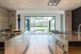 Kitchen, Wall Oven, Medium Hardwood Floor, Cooktops, and Recessed Lighting  Belinda Noemi’s Saves from Prestigious Modern Villa in Belgium Asks $6.8M