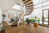 Staircase, Wood Tread, Metal Railing, and Glass Railing  Photo 3 of 6 in A Luxe Penthouse Overlooking Quebec asks $7.2M by Sotheby’s International Realty