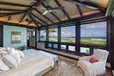Bedroom, Rug Floor, Bed, and Chair  Photo 4 of 5 in An Incredible Beachfront Estate in Hawaii Asks $19.8M by Sotheby’s International Realty