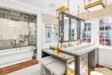 Bath Room, Medium Hardwood Floor, Ceiling Lighting, Marble Counter, Freestanding Tub, and Undermount Sink  Photo 3 of 5 in A Magnificent Home in Connecticut Asks $15.6M by Sotheby’s International Realty