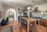 Kitchen, Recessed Lighting, Ceramic Tile Backsplashe, Range Hood, Range, and Refrigerator  Photo 3 of 5 in A Marvelous Home in South Carolina Asks $3.49M by Sotheby’s International Realty