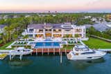 Outdoor, Large Patio, Porch, Deck, Back Yard, Grass, Trees, Shrubs, Large Pools, Tubs, Shower, and Walkways  Photo 1 of 5 in A Suburban Oasis in Florida Asks $27.9M by Sotheby’s International Realty
