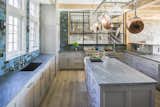 Kitchen, Undermount Sink, Light Hardwood Floor, Range, and Ceramic Tile Backsplashe  Photo 4 of 5 in An Impressive Farmhouse in Connecticut Asks $19M by Sotheby’s International Realty