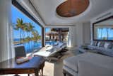 Living Room, Ceiling Lighting, Chair, Recliner, Sectional, Sofa, Ceramic Tile Floor, End Tables, Ottomans, and Recessed Lighting  Photo 8 of 11 in This Breathtaking Beachfront Estate in Mexico Asks 19.5M by Sotheby’s International Realty