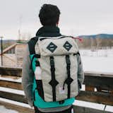 Our classic Klettersack, made even better. An ideal travel companion, workmate, or pack mule for even the wettest of environments. The X-Pac material boasts multiple layers, laminated together over a waterproof membrane. The X-Ply™ (diamond pattern) provides additional strength across the bias, traditionally the weakest part of the pack. We partnered this X-Pac material with Ballistic 1050D Cordura to finish the exterior and use a coated pack cloth for an entirely lined inner compartment. Our natural leather lash tabs are perfect for securing extra gear or attaching a bike light. Designed by Topo Designs, and handmade in Colorado.   Photo 9 of 13 in Bags & Packs by Topo Designs