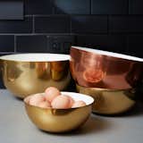 The Louise Bowls by Hawkins New York are constructed of spun aluminum having either a brass or copper finish, and lined in a warm white enamel. Perfect for prepping and serving, these lightweight, food safe bowls add a little metallic shine to any surface. We like to nest them for easy storage.