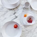 The Simple Dinnerware Collection by Hawkins New York is both organic and modern. The shapes were originally all hand formed and then cast to create a handmade feel. Intended for everyday use, the collection is made of durable stoneware having a simple, matte, white glaze. All pieces are dishwasher, microwave, and oven safe.