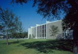 In 1953, Nina J. Cullinan gifted a building addition to Houston's Museum of Fine Arts as a memorial for her parents. Her only stipulation was that it had to be designed by an architect of "outstanding reputation and wide experience." After being selected for the commission, Mies arrived in Houston on a hot summer day and rejected the idea of a standard open museum courtyard by remarking, "But in this climate, you cannot want an open patio."