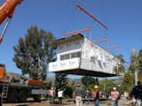 The Palisades Prefab being lowered into place.  Photo 9 of 15 in Eco-Friendly Prefabs and the Modern Mobile Home: Spotlight on Jennifer Siegal