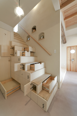 This home in Koriyama, Japan, by Architect Kotaro Anzai, takes its cues from traditional Japanese carpentry techniques that use staircases to maximize storage.&nbsp;