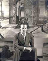 John Yeon photographed in 1941 at the Julien Levy Gallery in New York, seated in front of Eugene Berman's painting  Photo 15 of 15 in Spotlight on John Yeon, the Father of Northwest Regional Architecture