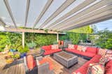 Outdoor Equipped with outdoor living, kitchen and dining areas—and a stunning fire pit, the deck also boasts a built-in spa.  Photo 2 of 9 in On the Market For $4.5M, This Venice Beach Compound Captures the Essence of Indoor-Outdoor Living
