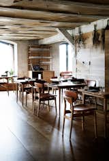 Upon entering the restaurant, guests are met with a warm oak floor, which is in contrast to the rough texture of the original stone walls.  Photo 3 of 10 in Snøhetta Designs the Interiors of Barr, the Noma Group’s New  Copenhagen Restaurant