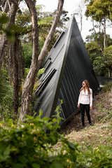 Set in the New Zealand rain forest, the Tate has landscaped the site with hundreds of plants exclusive to New Zealand to recreate a natural native forest landscape.