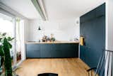 Kitchen, Wood Counter, Wood Cabinet, Light Hardwood Floor, Pendant Lighting, Wall Oven, Vessel Sink, Subway Tile Backsplashe, and Cooktops Danish architect Sigurd Larsen needed a new kitchen for his 969-square-foot apartment in the hip Kreuzberg district of Berlin—so he designed his own in collaboration with Reform. Larsen opted for a kitchen in anthracite—as the darker color added contrast to his oak floors and countertops.  Photo 4 of 16 in 15 Fresh Ideas for Replacing Your White Kitchen Cabinets from Modern Kitchen Upgrade Ideas From a Danish Design Firm That's Challenging the Kitchen Market
