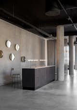 Kitchen, Table, Track, Concrete, Concrete, and Metal Norm Architects designed Danish brand Menu's recently opened 7,500-square-foot showroom that's located in the upcoming Copenhagen neighborhood that surrounds the harbor in Nordhavn.  Kitchen Concrete Track Photos from Modern Kitchen Upgrade Ideas From a Danish Design Firm That's Challenging the Kitchen Market