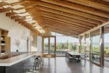 Two large sliding doors centered with the tasting room bar bring the vineyard into the space, while also serving as a passive cooling system in the summer when used in tandem with the upper clerestory windows.&nbsp;