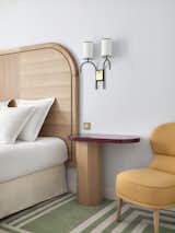 Bedroom, Bed, Night Stands, Chair, Wall Lighting, and Carpet Floor  Photo 11 of 19 in Hôtel Bienvenue by Dwell from Tour a Charming Parisian Hotel That Just Got an Amazing Makeover