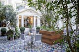 Outdoor, Large Patio, Porch, Deck, Trees, Raised Planters, and Garden  Photo 17 of 19 in Tour a Charming Parisian Hotel That Just Got an Amazing Makeover