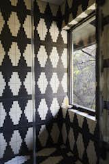 Bath Room, Stone Tile Wall, Open Shower, and Cement Tile Floor Graphic black and white cement tile was added in the renovation.  Photos from A Hudson Valley Home’s Renovation Is Guided by Its Best Midcentury Feature