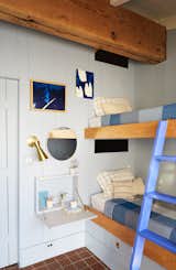 Bedroom, Bunks, Wall, Terra-cotta Tile, and Night Stands The bunk beds are original only repainted and treated to updated detailing.  Bedroom Terra-cotta Tile Photos from A Hudson Valley Home’s Renovation Is Guided by Its Best Midcentury Feature