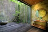 Bath, Recessed, Dark Hardwood, Pedestal, Wood, and Drop In  Bath Wood Recessed Drop In Photos from An Incredible Vacation Villa in the Balinese Jungle That’s Part Chameleon