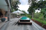 Outdoor, Wood Patio, Porch, Deck, Trees, Shrubs, Back Yard, and Raised Planters  Photo 18 of 18 in An Incredible Vacation Villa in the Balinese Jungle That’s Part Chameleon