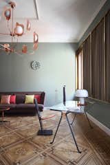 Lars sofa by Bonaldo, Leaf chandelier by MM Lampadari, Frate desk by Enzo Mari for Driade with table lamp by Sottsass for Vistosi,