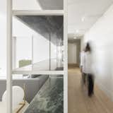 Hallway and Light Hardwood Floor  Photo 5 of 16 in A Luminous Renovation in Portugal Creates a Bright and Airy Apartment